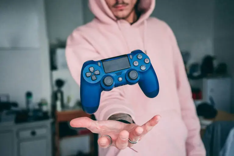 person holding blue Sony PS4 Dualshock 4 by Florian Gagnepain